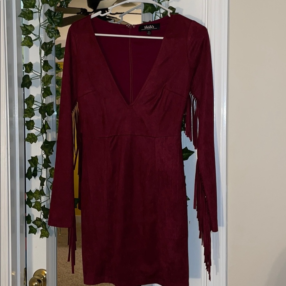 tight tassel dress with deep plunging neckline 👗